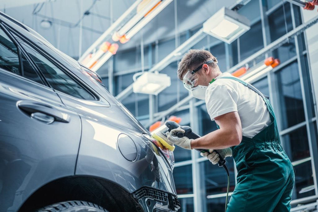 man fixing car ICBC collision auto body repair langley on line collision